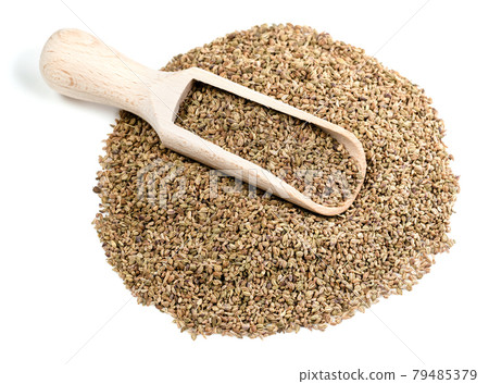 wooden scoop on pile of ajowan fruits on white wooden scoop on pile of ajowan fruits on white 79485379