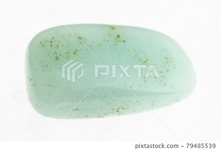 polished aquamarine (blue beryl) gemstone on white 79485539