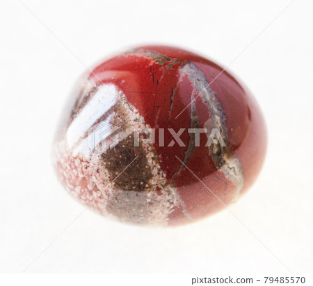 tumbled red brecciated jasper stone on white tumbled red brecciated jasper stone on white 79485570