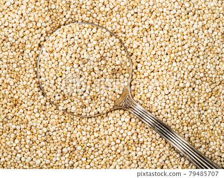 top view of tablespoon in quinoa seeds top view of tablespoon in quinoa seeds 79485707
