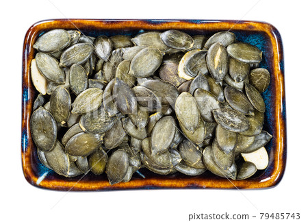 top view of styrian pumpkin seeds in bowl cutout top view of styrian pumpkin seeds in bowl cutout 79485743