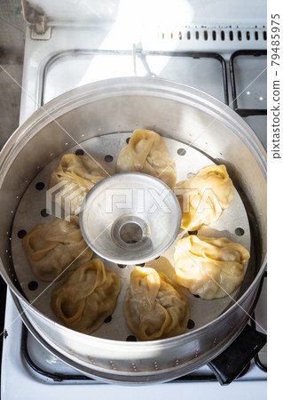 homemade manti dumpling are cooking in steamer homemade manti dumpling are cooking in steamer 79485975