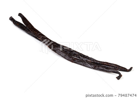 two different dried vanilla beans closeup on white two different dried vanilla beans closeup on white 79487474