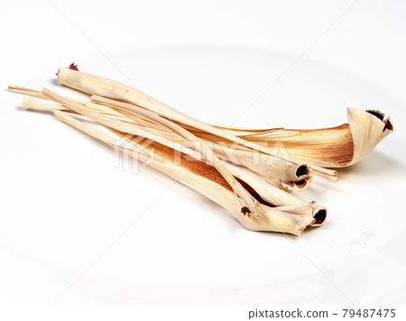 dried lemongrass close up on white plate dried lemongrass close up on white plate 79487475