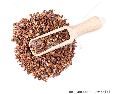 top view of scoop on pile of pink sichuan pepper top view of scoop on pile of pink sichuan pepper 79488151