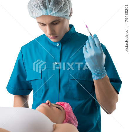 Surgeon giving lip beauty injections to a girl 79488291