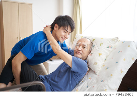 Male caregiver with an elderly person 79488405