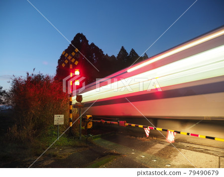 Railroad crossing in the evening Railroad crossing in the evening 79490679