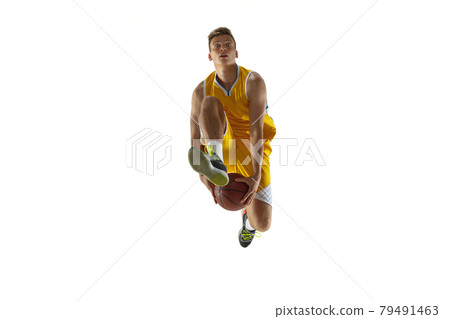 One young man, basketball player with a ball training isolated on white studio background. Advertising concept. Fit Caucasian athlete jumping with ball. One young man, basketball player with a ball training isolated on white studio background. Advertising concept. Fit Caucasian athlete jumping with ball. 79491463