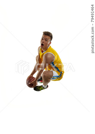 High angle view of young man, basketball player with a ball training isolated on white studio background. Advertising concept. Fit Caucasian athlete jumping with ball. 79491464