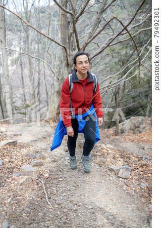 Young tourist woman walking in Spanish Pyrenees mountain in autumn 79492301