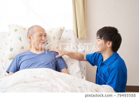 Smiley caregiver and the elderly 79493588