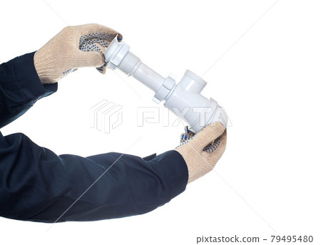 Plumber holding a drain siphon on a white background, isolate, close-up. Equipment 79495480