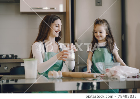 Family cook the dough for cookies Family cook the dough for cookies 79495835