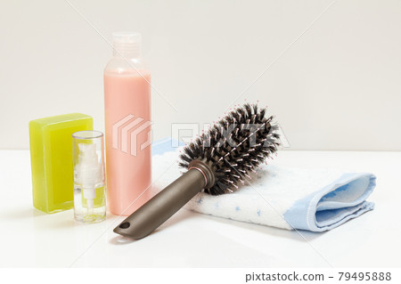 Women wash accessories on a white background. 79495888