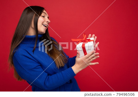 Beautiful happy young brunette woman isolated over colourful background wall wearing stylish casual 79496506