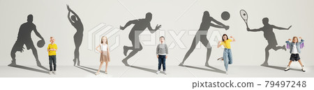 Collage. Dreams about big and famous future. Conceptual image with little boys and girls and shadows of fit professional sportsmen on light gray background Collage. Dreams about big and famous future. Conceptual image with little boys and girls and shadows of fit professional sportsmen on light gray background 79497248
