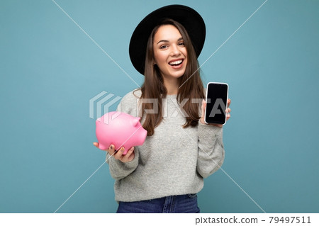 Portrait photo of happy positive smiling satisfied sincere young attractive brunette woman wearing Portrait photo of happy positive smiling satisfied sincere young attractive brunette woman wearing 79497511