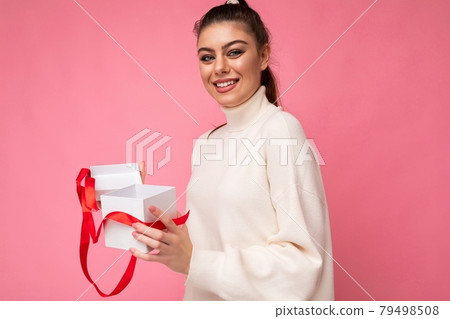 Shot of attractive positive smiling young brunette woman isolated over colourful background wall 79498508