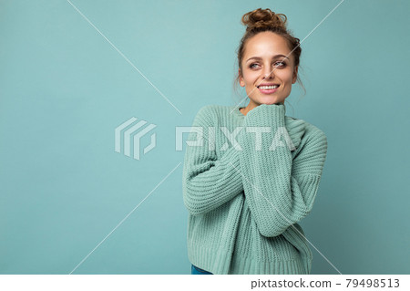 Young beautiful cute curly blonde woman with sexy expression, cheerful and happy face wearing trendy 79498513