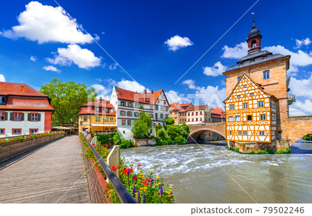 Bamberg, Germany - Half-timebered town hall and bridge decorated by flowers, Bavaria. Bamberg, Germany - Half-timebered town hall and bridge decorated by flowers, Bavaria. 79502246