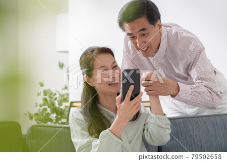Senior couple good friend smartphone Senior couple good friend smartphone 79502658