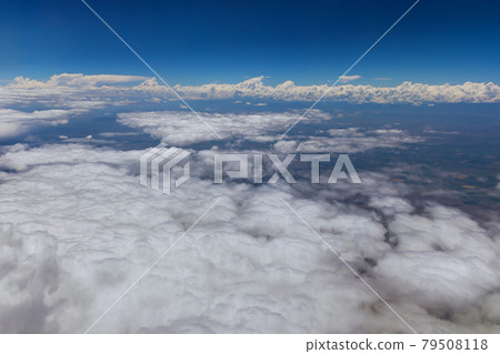 Overview in desert Arizona from the plane of fluffy clouds in mountains an airplane Overview in desert Arizona from the plane of fluffy clouds in mountains an airplane 79508118