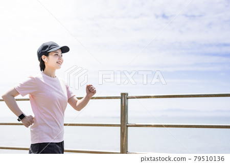 Young woman walking Young woman walking 79510136