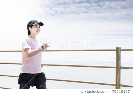 Young woman walking Young woman walking 79510137