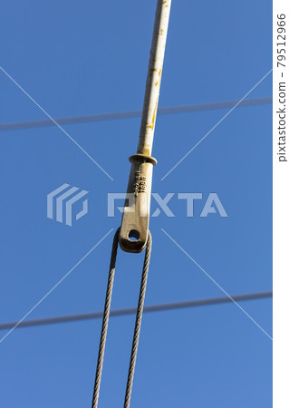 Photograph of a tensioner bracket on a transmission line 79512966