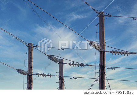 Photograph of a wooden telephone post and cables 79513883