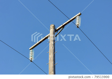 Photograph of a wooden telephone post and cables 79513900