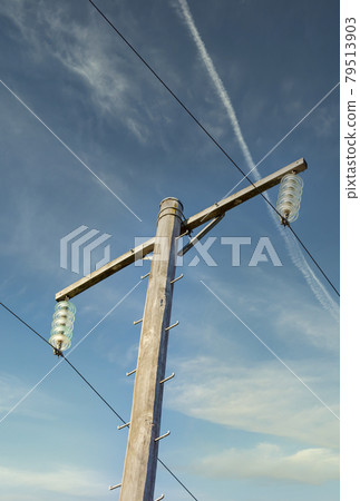Photograph of a wooden telephone post and cables 79513903