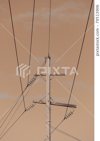 Photograph of a wooden telephone post and cables Photograph of a wooden telephone post and cables 79513906