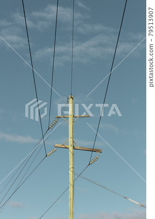 Photograph of a wooden telephone post and cables 79513907