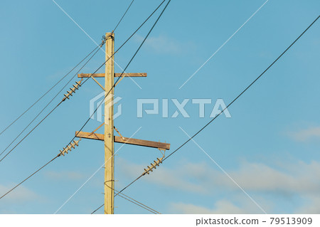 Photograph of a wooden telephone post and cables 79513909