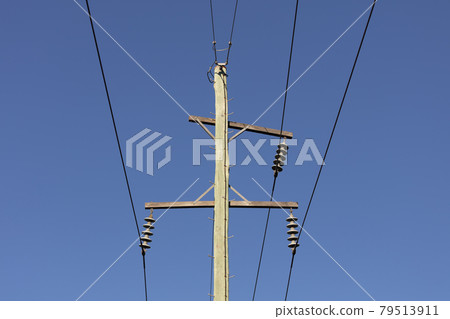 Photograph of a wooden telephone post and cables 79513911