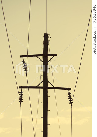 Photograph of a wooden telephone post and cables 79513940