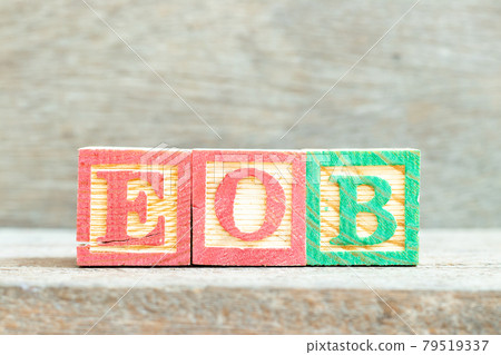 Color alphabet letter block in word EOB (Abbreviation of end of business) on wood background 79519337