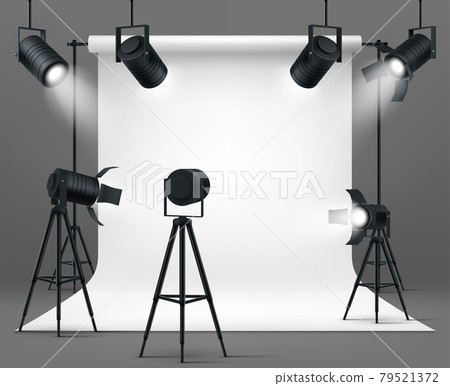 Photo studio with spotlights and white background 79521372