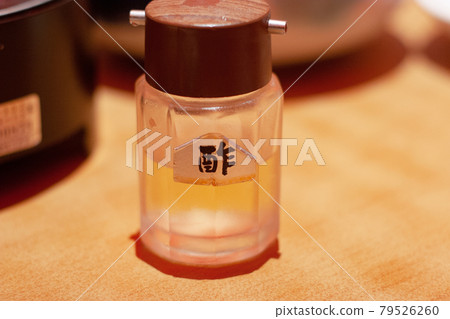 a bottle of white vinegar at table 79526260