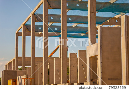 Construction site with precast concrete columns, beams and walls Construction site with precast concrete columns, beams and walls 79528369