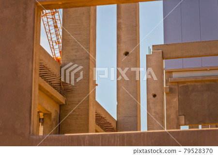 Construction site with precast concrete columns, beams and walls Construction site with precast concrete columns, beams and walls 79528370