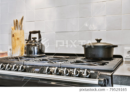 Interior of a beautiful kitchen of an elite house Interior of a beautiful kitchen of an elite house 79529165