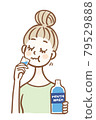 Young woman doing bad breath care with mouthwash 79529888