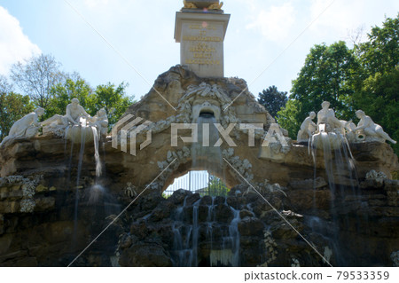 VIENNA, AUSTRIA - APR 30th, 2017: View of Obelisk Fountain Obeliskbrunnen in the public park of Schonbrunn Palace 79533359