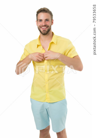 Dressing room. Attractive man taking off shirt. Confident Dressing room. Attractive man taking off shirt. Confident 79533658