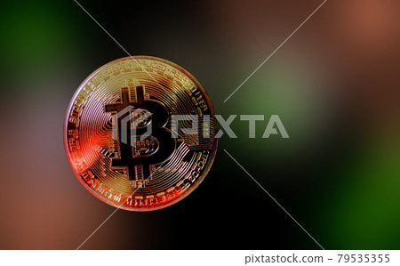Neon light reflected on Bitcoin coin on vivid background new kind of financial technology with copy space Neon light reflected on Bitcoin coin on vivid background new kind of financial technology with copy space 79535355