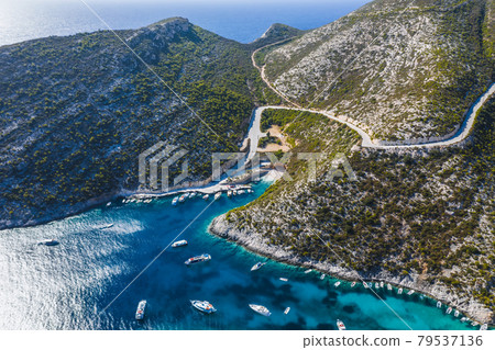 Greece. Aerial view of beautiful Porto Vromi with many fisher and tourist pleasure boats in the blue bay. Zakynthos - Zante island 79537136