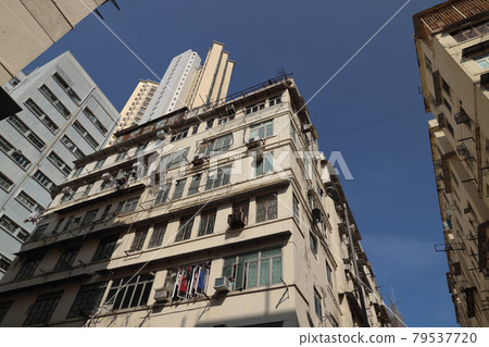 10 April 2021 Local city street scene with high density traditional residential buildings 10 April 2021 Local city street scene with high density traditional residential buildings 79537720